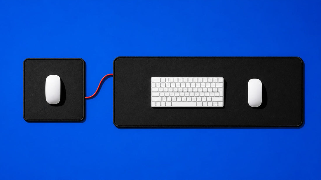 Regular mouse pad and extended keyboard mat compared from above on a royal-blue background