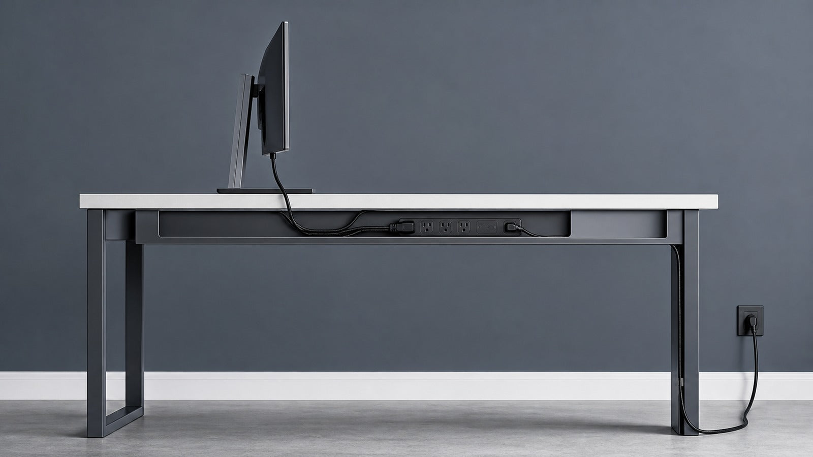 Side view of a desk with a hidden under-desk power and cable route