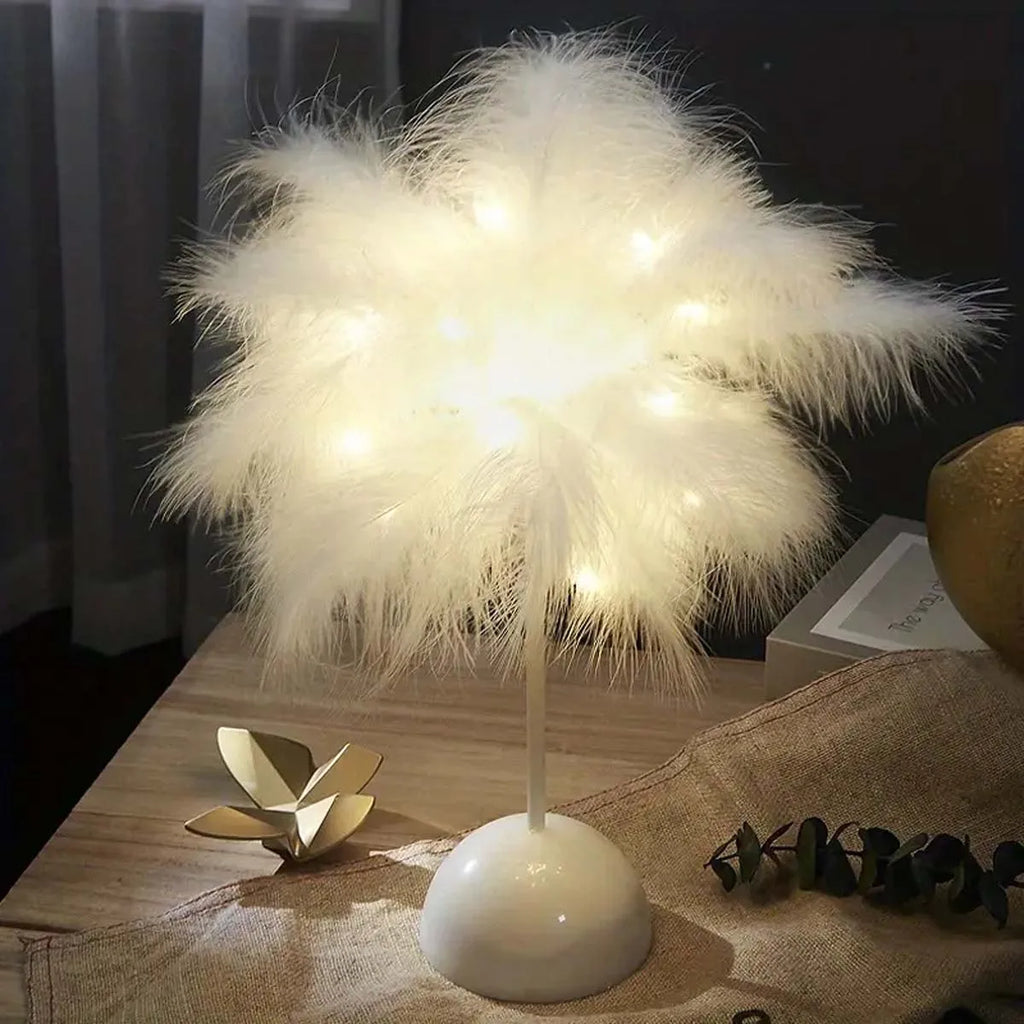 Warm-lit white feather lamp on a nightstand in a dark bedroom