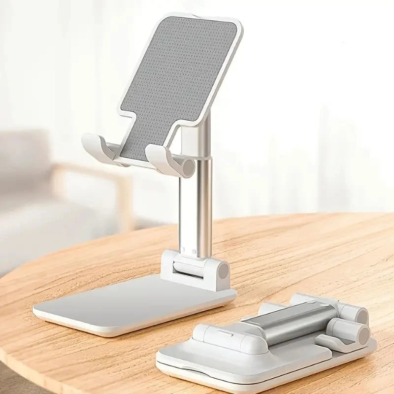 White desktop phone stand shown open and folded on a wood surface