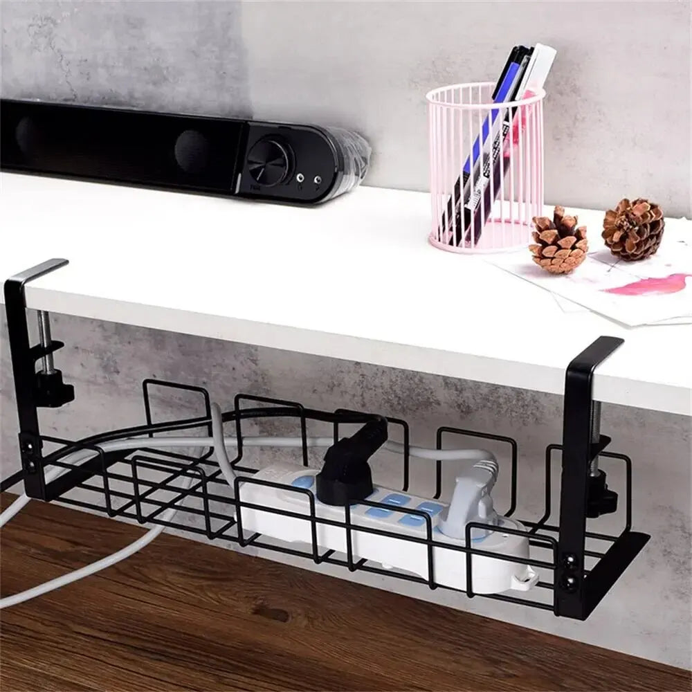 Corner view of the black wire cable tray keeping cords off the floor