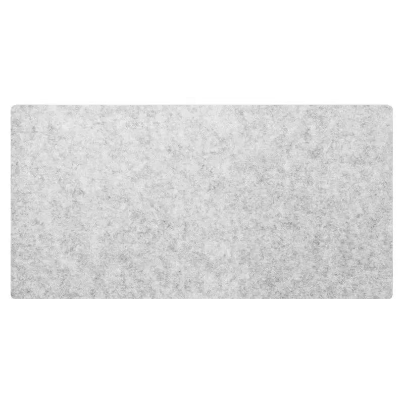 Light grey felt desk mat lying flat on a white background