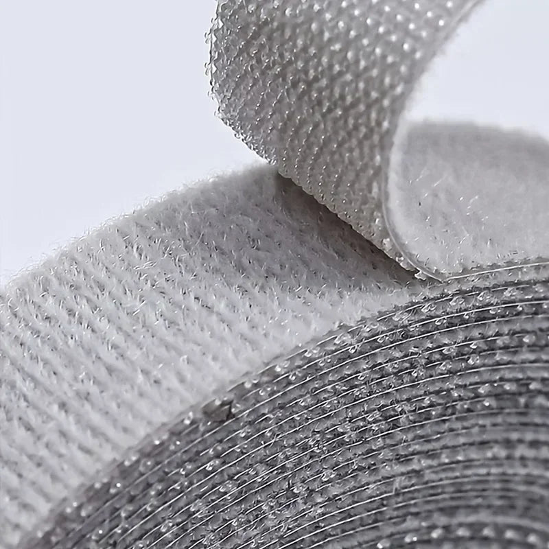 Close-up of the hook-and-loop texture of the gray cable wrap