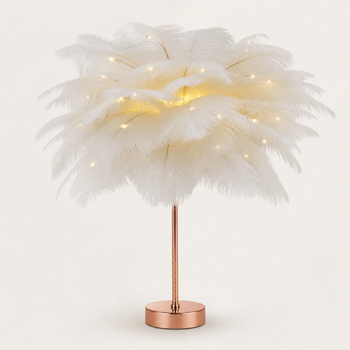 White feather LED table lamp with rose-gold base on a warm off-white background