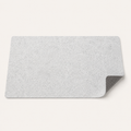 Light gray non-slip felt desk mat with dotted backing