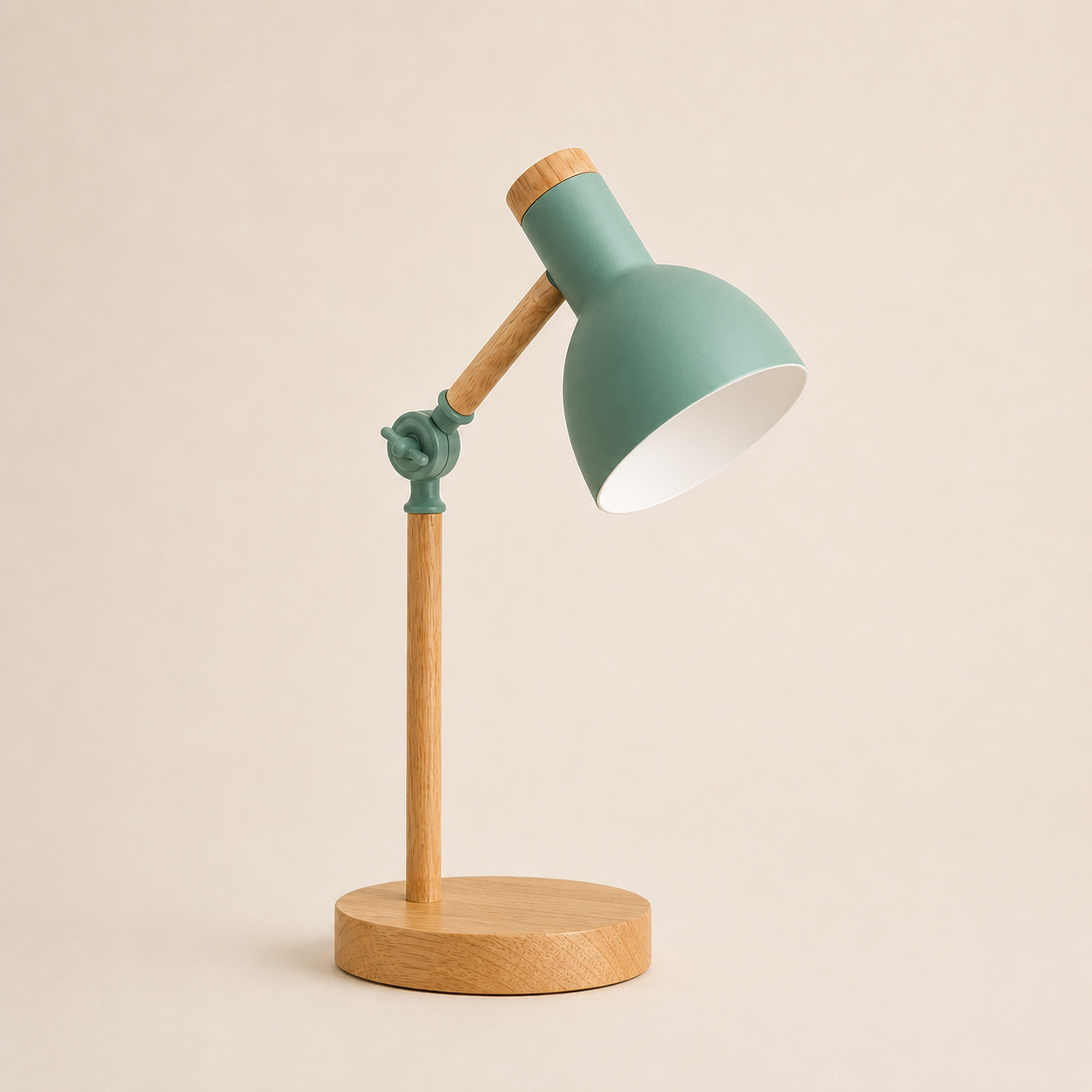 Green wood turn-head table lamp on a square off-white studio background