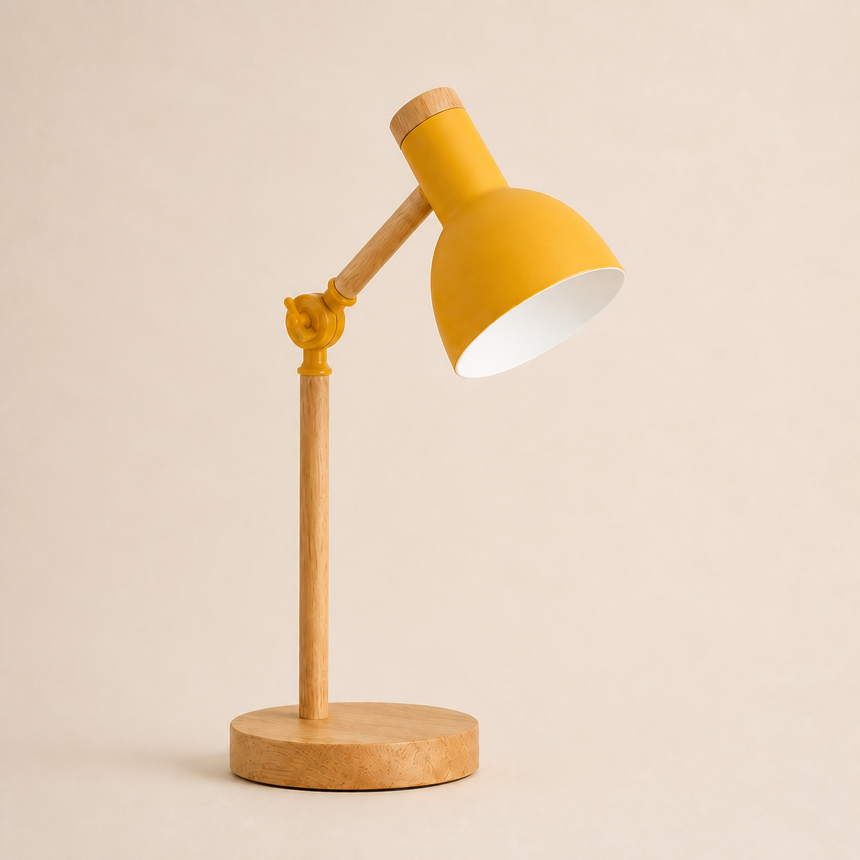 Yellow wood turn-head table lamp on a square off-white studio background